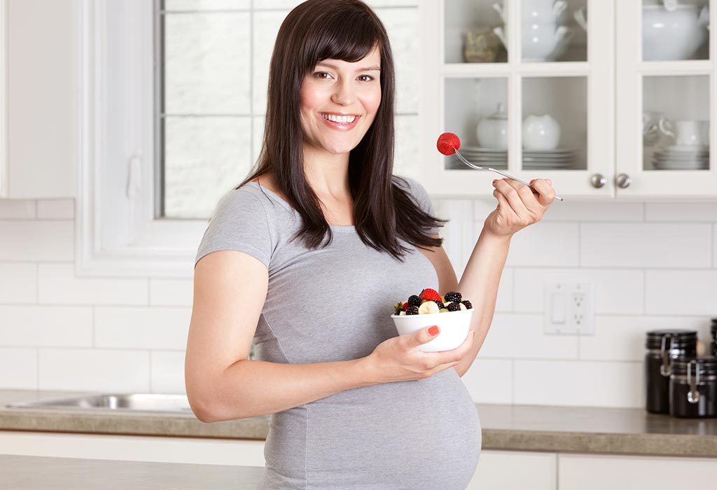 A pregnant woman eating healthy