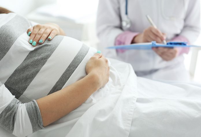 Pregnant woman getting ready for a membrane sweep