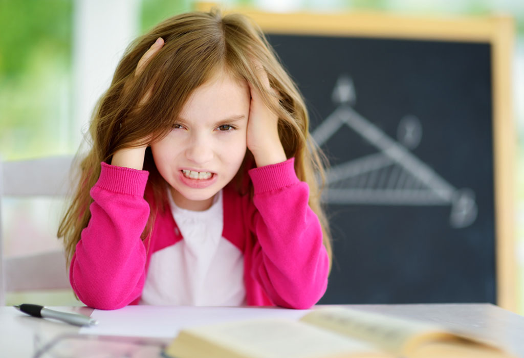 A little girl looking angry and irritated