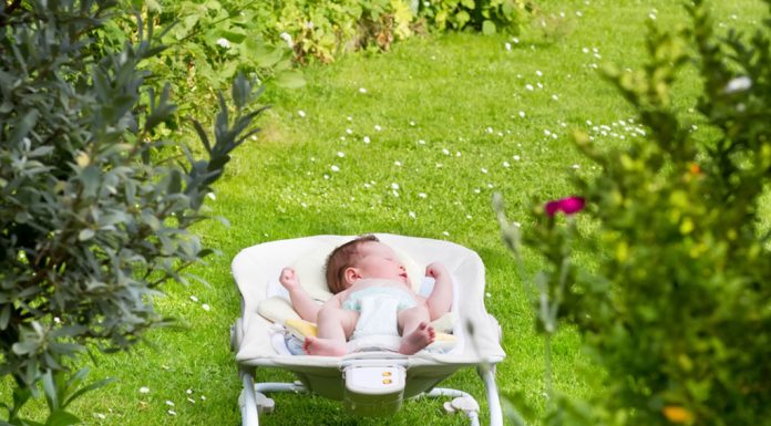 A baby sleeping in the garden
