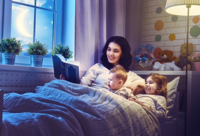 Mom reading to her children