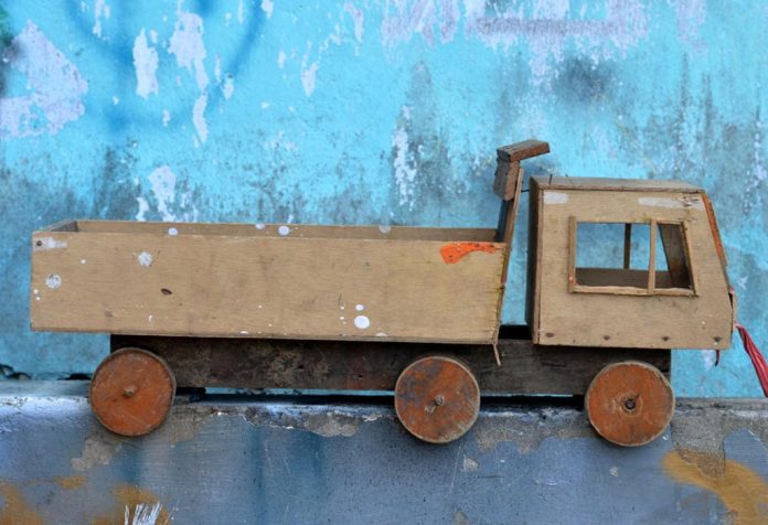A wooden toy car