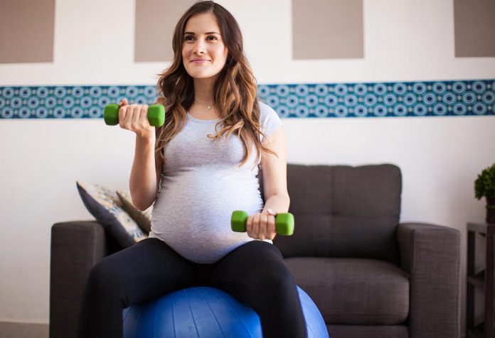 A pregnant woman exercising