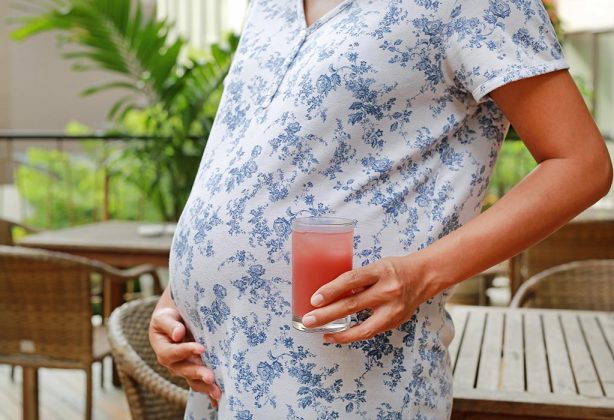 pregnant woman eating watermelon